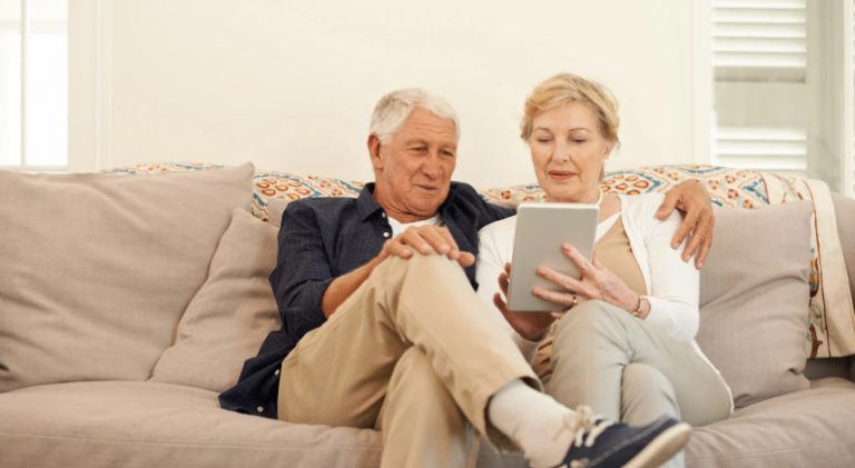 retired couple sitting on the couch