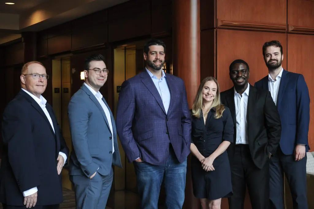 Close up team photo of Fuchs Financial Advisors. This photo features Jeff Singer, Alex Cal, Ben Fuchs, Gina Mazzadra, Eddy Agyeman, and Josh Kerchis.