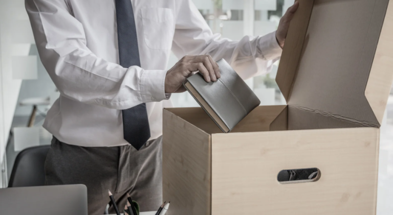 image of someone packing up there desk after leaving a job