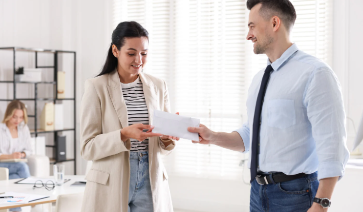 boss giving an employee a bonus