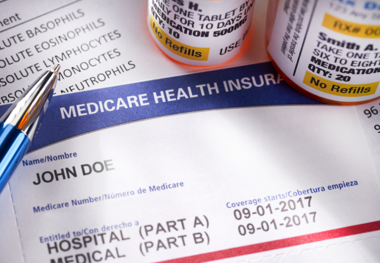 This image is a picture of prescriptions with a medicare insurance card alongside the text of eligibility due to disability