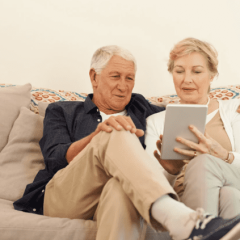 retired couple sitting on the couch